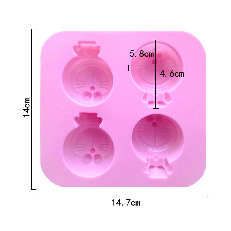 Pink silicone mold with cartoon character design and measurements on a white background