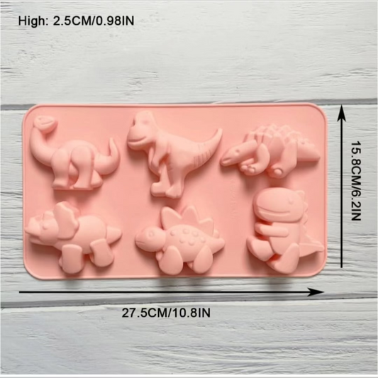 Pink 6-cavity dinosaur silicone baking mold displaying various dinosaur shapes and dimensions (27.5 cm x 15.8 cm).