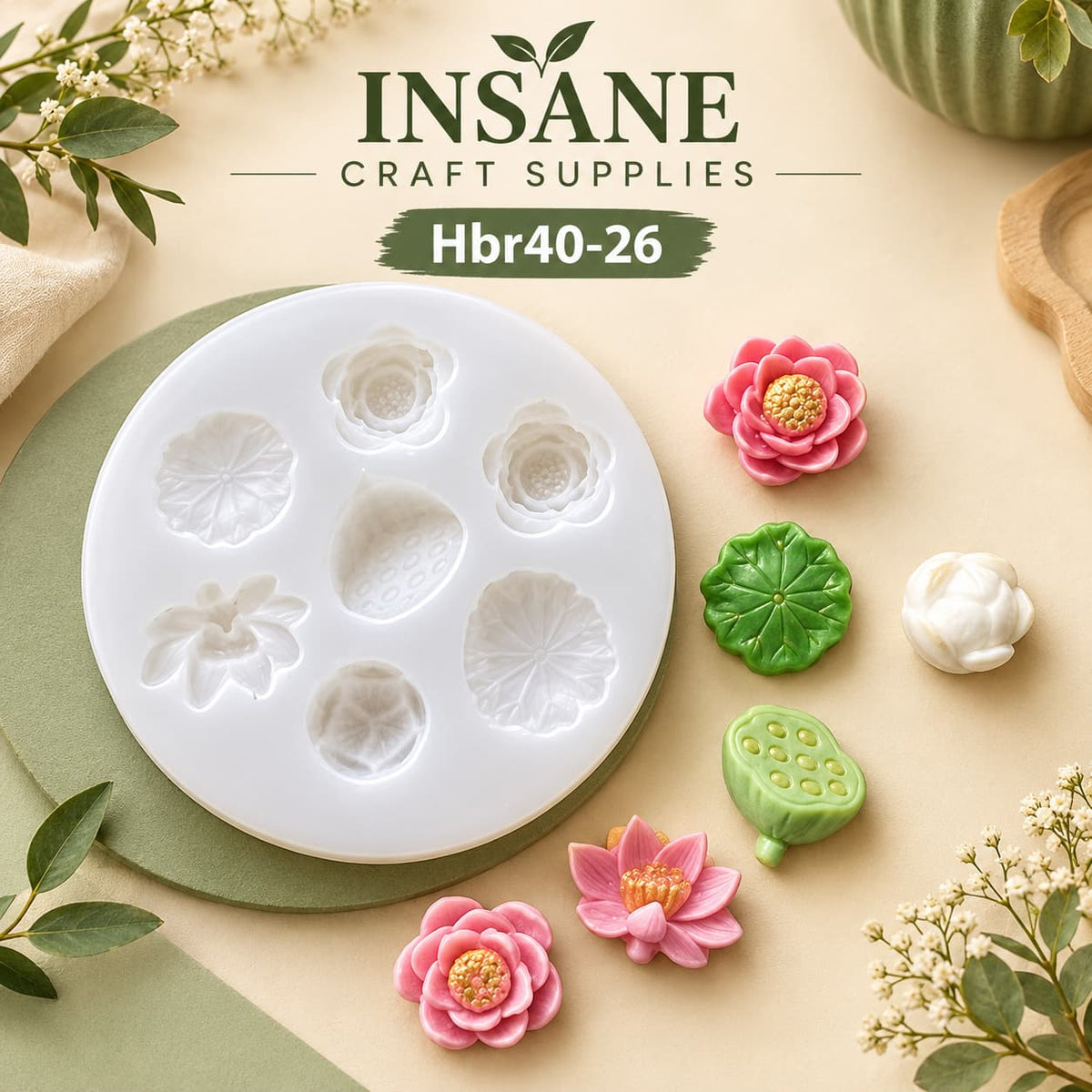 White circular silicone mold tray with six flower-shaped cavities, shown on a beige background with decorative green leaves and small pink and green flower samples. Text at the top reads INSANE CRAFT SUPPLIES and Hbr40-26.