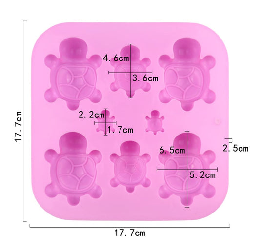 Silicone mold with turtle shapes and measurements on a white background