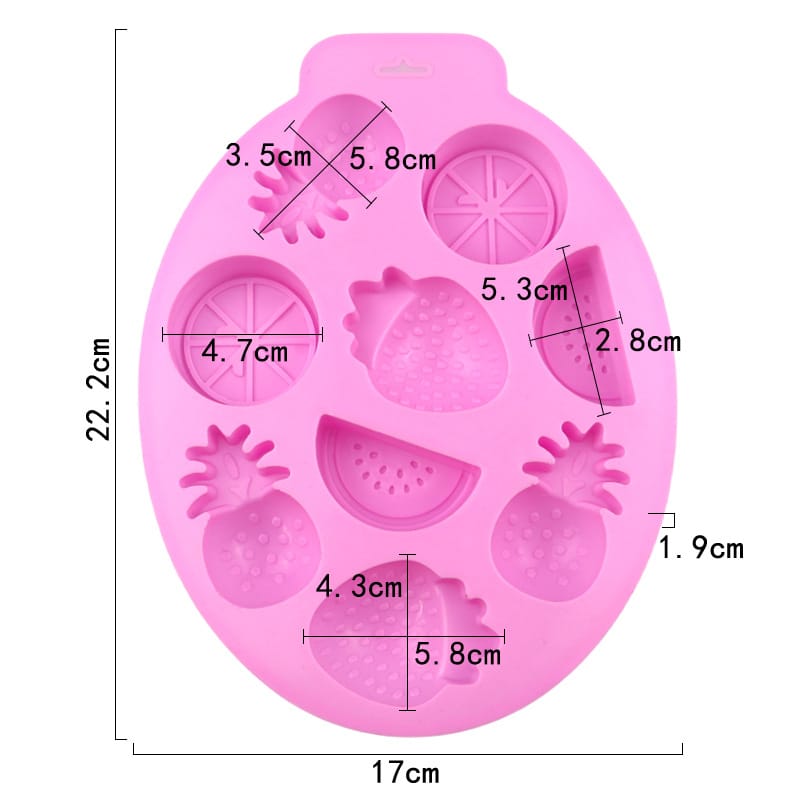Pink silicone mold with fruit shapes and measurements on a white background