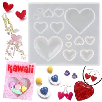 Heart-shaped silicone mold with jewelry items and 'Kawaii' packaging on a white background