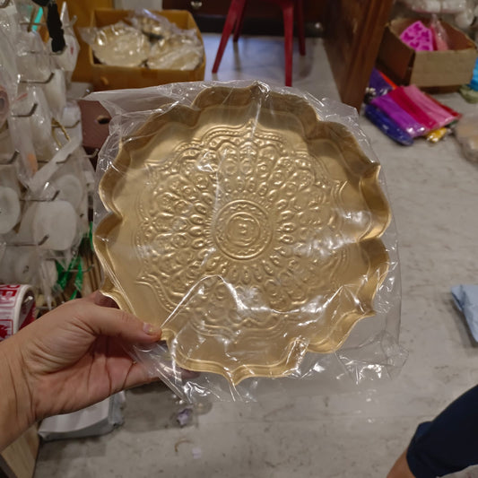 Gold metal urli with embossed mandala design for decorative candle making, approximately 9 inches